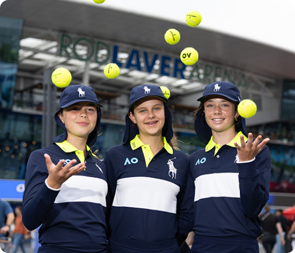 Ballkids juggling tennis balls outside Rod Laver Arena